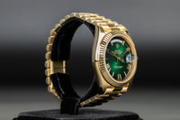 Rolex<br>228238 DayDate 40 Green Hombre Roman Numeral Dial