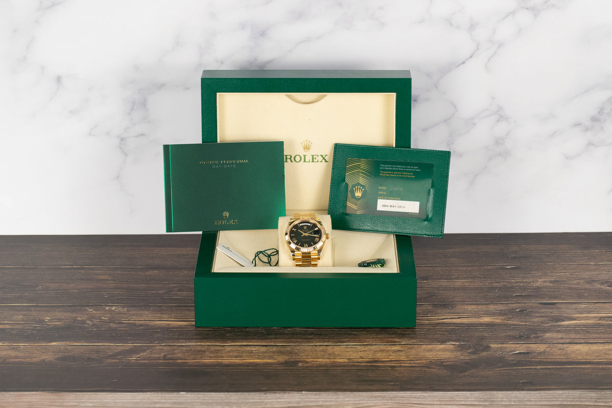 Rolex<br>228238 DayDate 40 Green Hombre Roman Numeral Dial